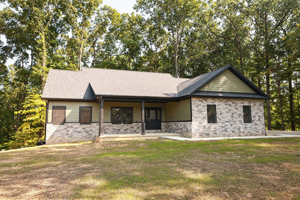 Newly built gabled home with a covered porch.